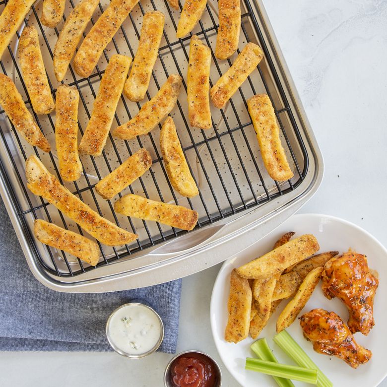 baking try with french fries on rack.