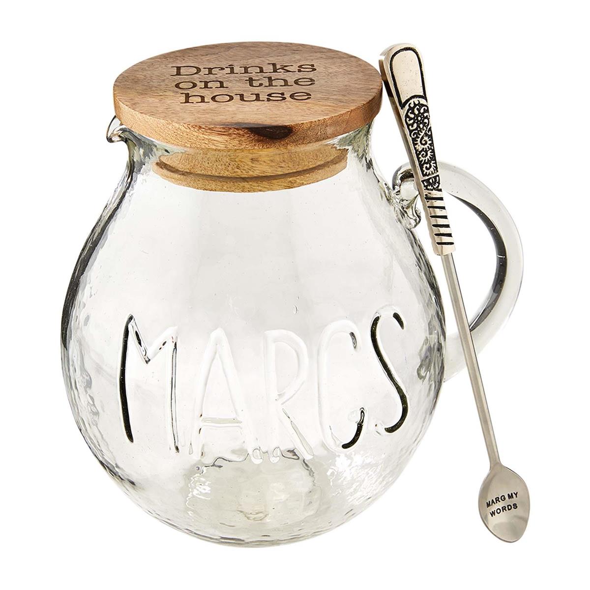 margarita pitcher with lid and mixing spoon on a white background