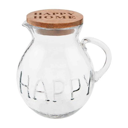 glass happy pitcher with wood lid against a white background