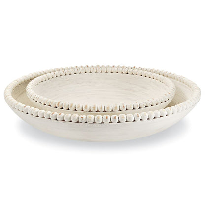 small and large beaded wooden bowls stacked on a white background