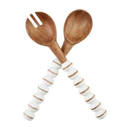 white and natural beaded serving utensils on a white background
