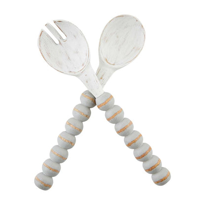 gray and white beaded serving utensils on a white background