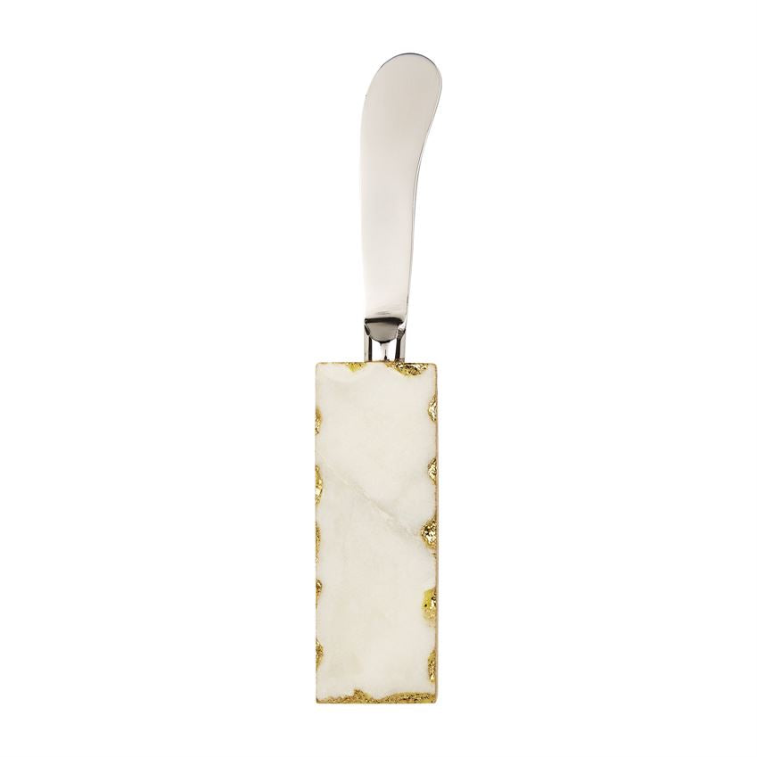 stainless steel spreader with white marble and gold rimmed handle.
