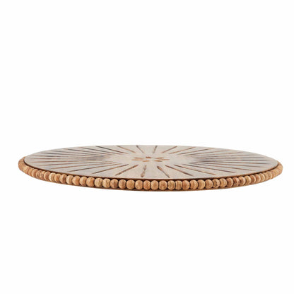 beaded cared wood lazy susan on a white background