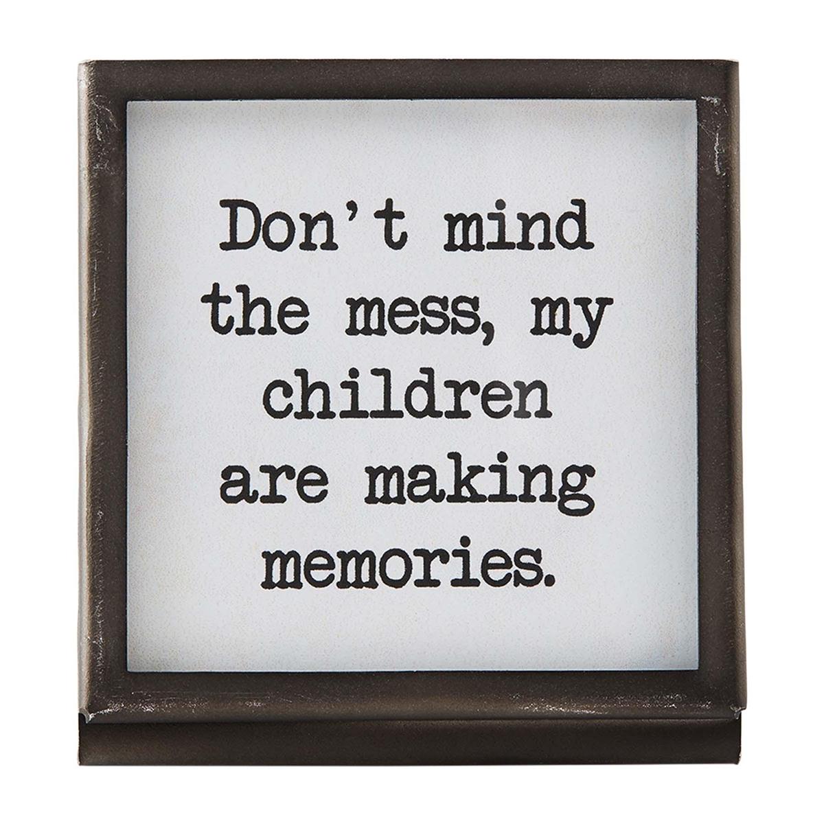 mind the mess black metal framed saying on a white background