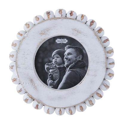small round white beaded frame displayed against a white background