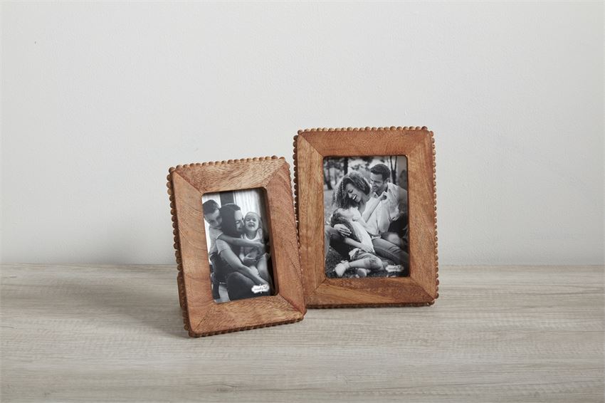 small and large wooden beaded frames on a light tan surface