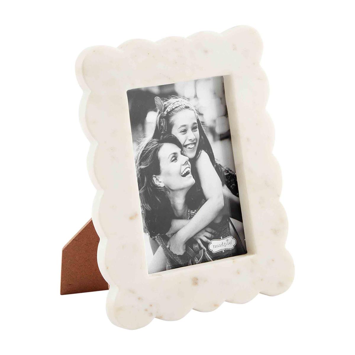 small scalloped marble frame on a white background