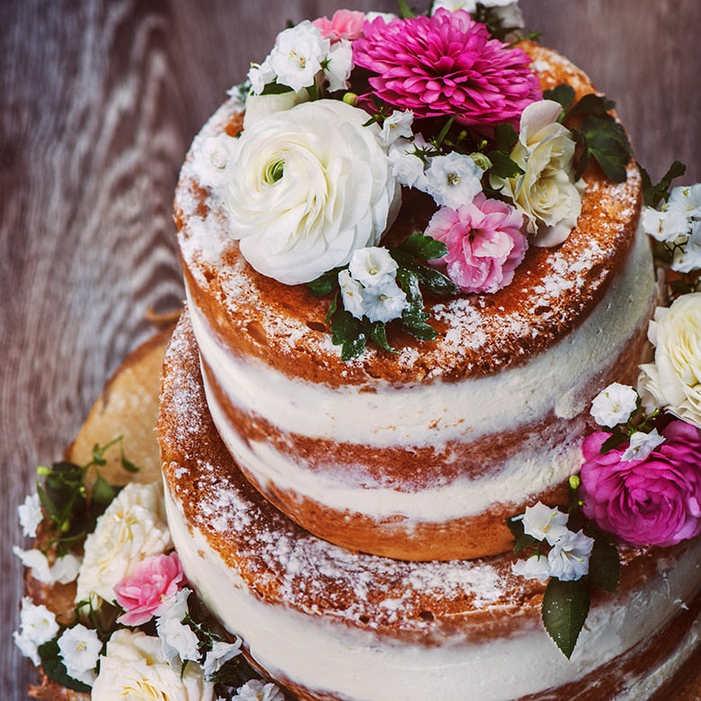 tiered round cake decorated with flowers.