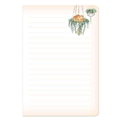 example lined page of notebook with cat sitting in plant in top corner.