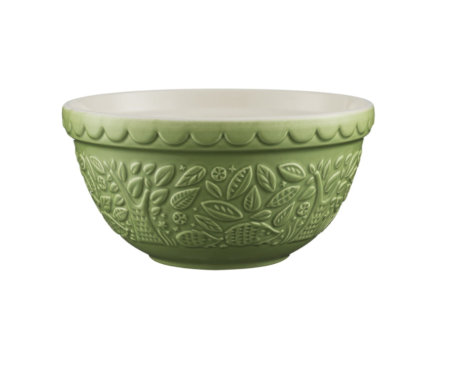 green ceramic mixing bowl with hedgehog design on white background.
