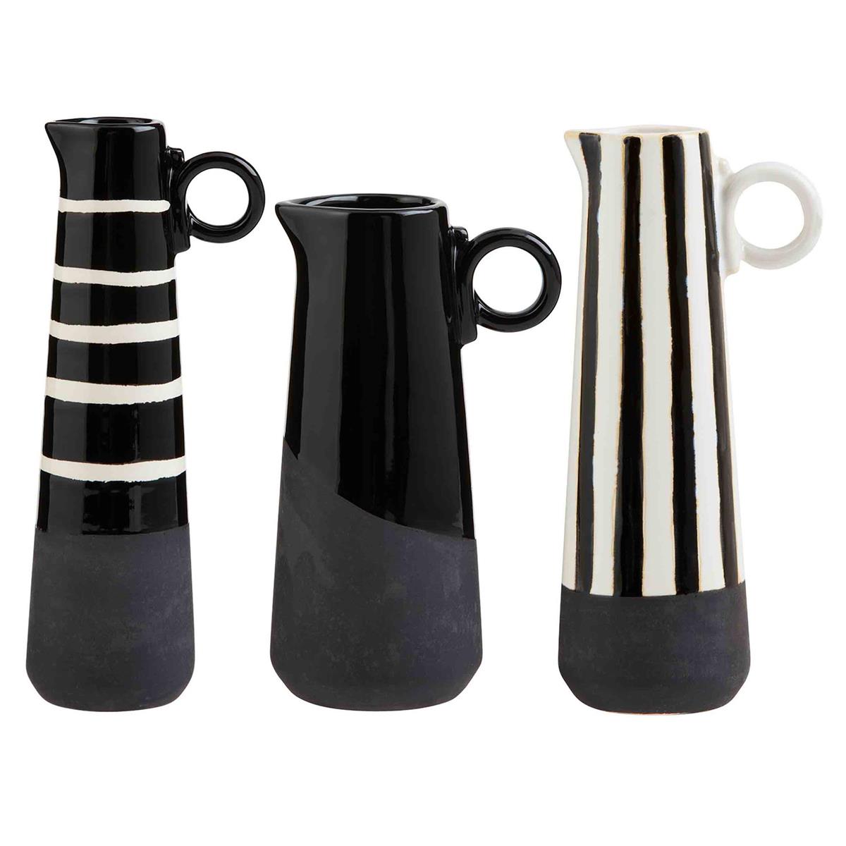 all three styles of black and white bud vases against a white background