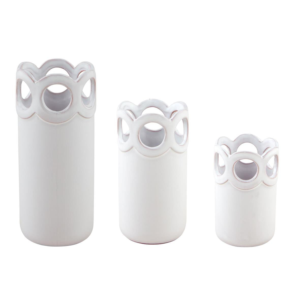 all three sizes of the scalloped bud vases on a white background