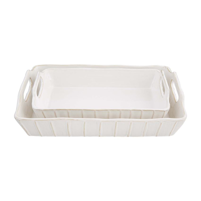 small and large textured baking dish stacked on a white background