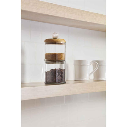 door knob storage jar set filled with brown sugar and coffee beans and displayed on a open shelf in a kitchen next to two coffee mugs