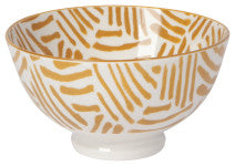 white ceramic bowl with yellow line patterns inside and out.
