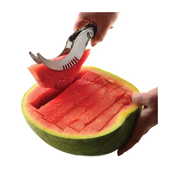 watermelon slicer lifting watermelon slices out of watermelon rind.