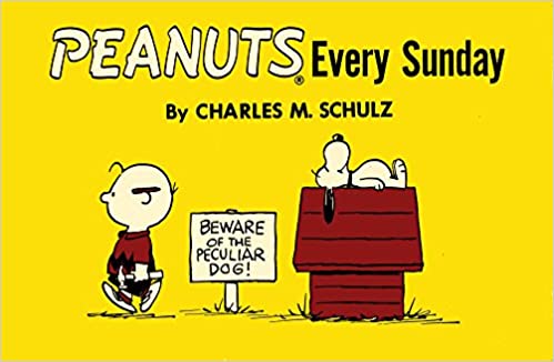 front cover of book is yellow with drawing of snoopy lying on his doghouse and charlie brown walking away, title, and authors name