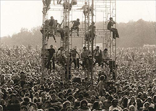 front cover of card is a black and white photo of a crowd of people and a tower with people climbing on it