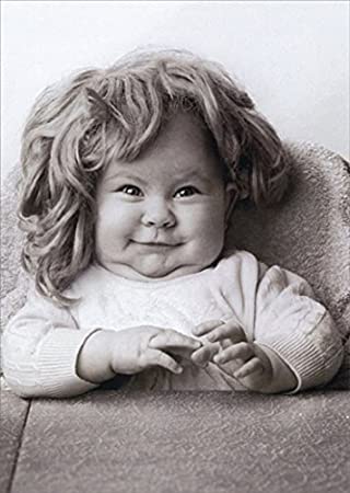 front of card is a black and white photograph of a smiling baby wearing a wig