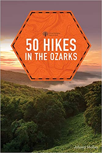 cover of book with forest scenery and the title in an orange hexagon.