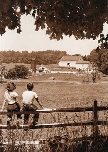 front of card is photograph of two kids sitting on a fence overlooking an old farm
