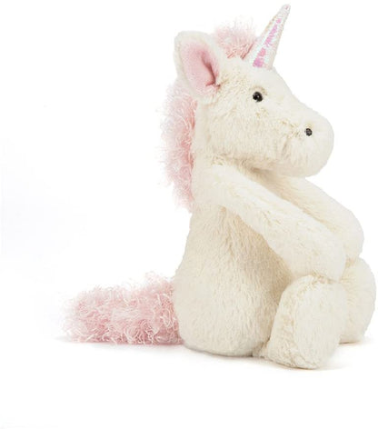 side view of the bashful unicorn on a white background