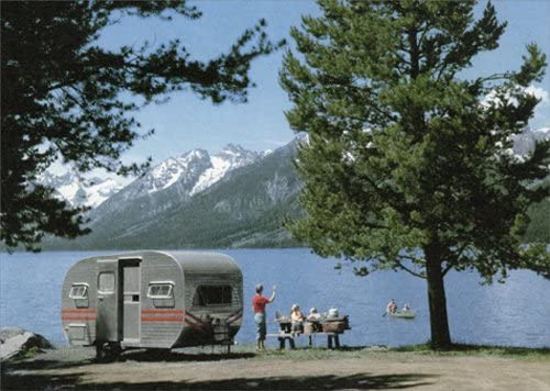 front of card is photograph of people and a camper trailer parked at a lake overlooking mountains