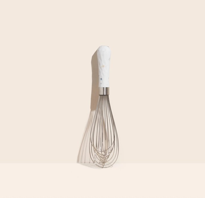 the barcelona ulitmate whisk on a pale pink background