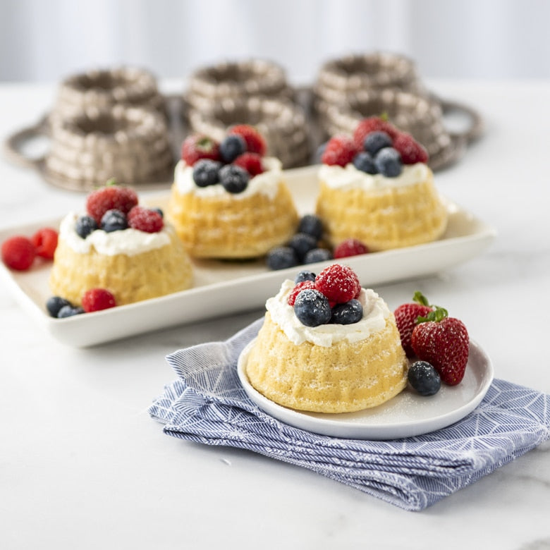 mini shortcake basket cakes topped with berries.