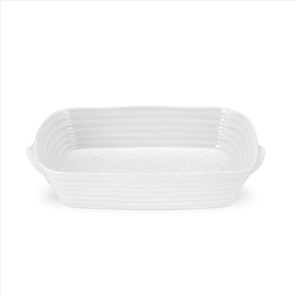 white roasting dish with handles on a white background.