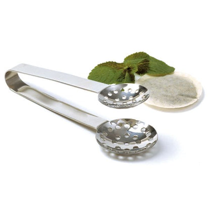 metal tea bag squeezer with tea bag and fresh mint on white background.