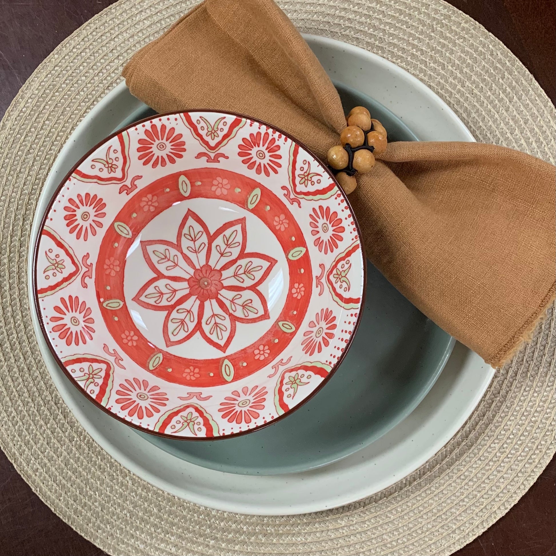 mirabelle bowl displayed on a dinner and salad plate with a charger and napkin on a table