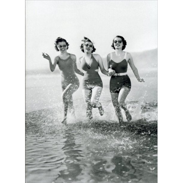 front cover of card has a black and white photo of three women running through the water at the beach