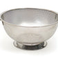 stainless steel colander on white background.