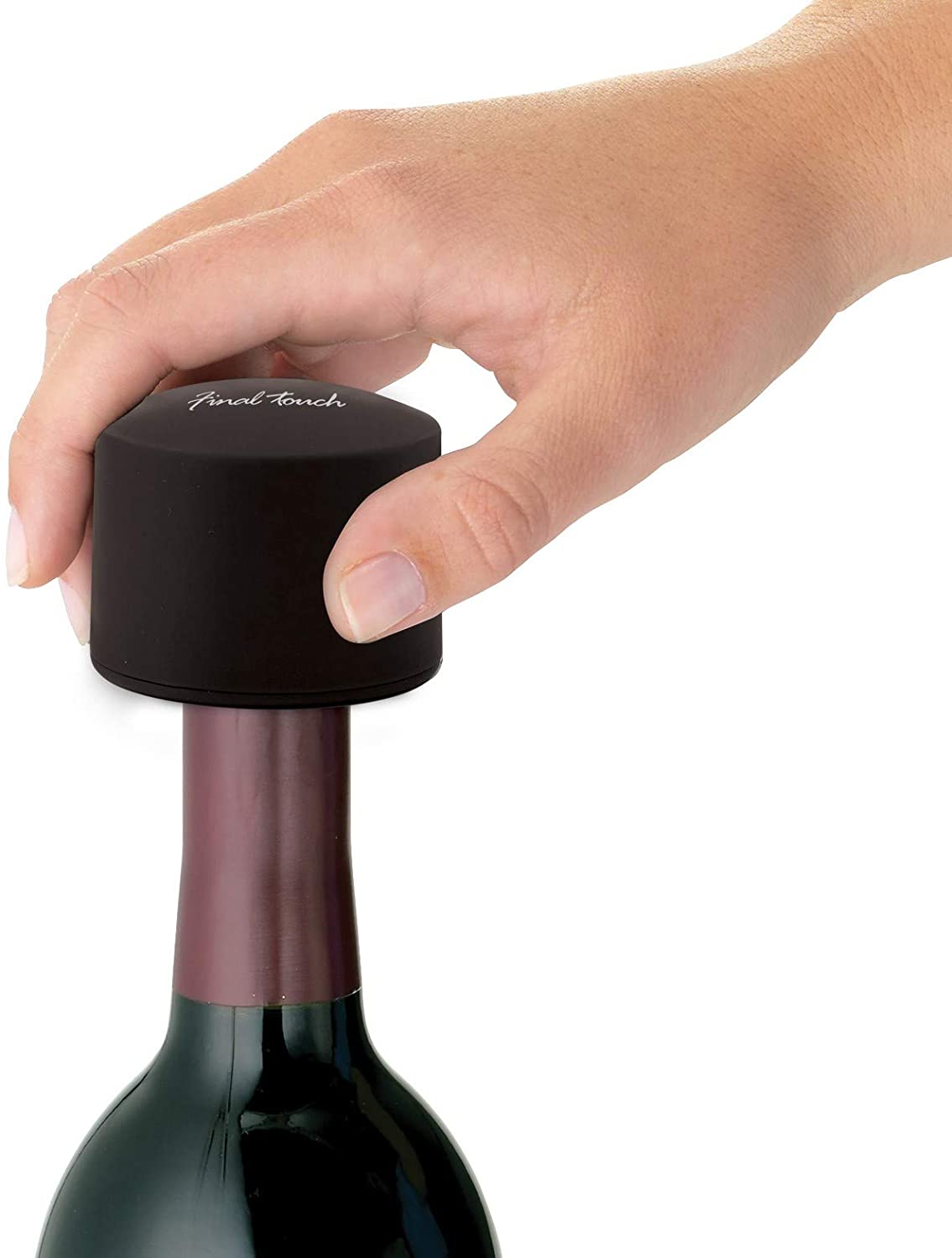 a person using the foil cutter on a wine bottle against a white background