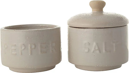 pepper pot set next to salt pot.