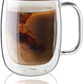 double wall glass with handle filled with coffee beverage swirled with cream