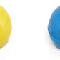 yellow and blue tabletop bowling balls on a white background