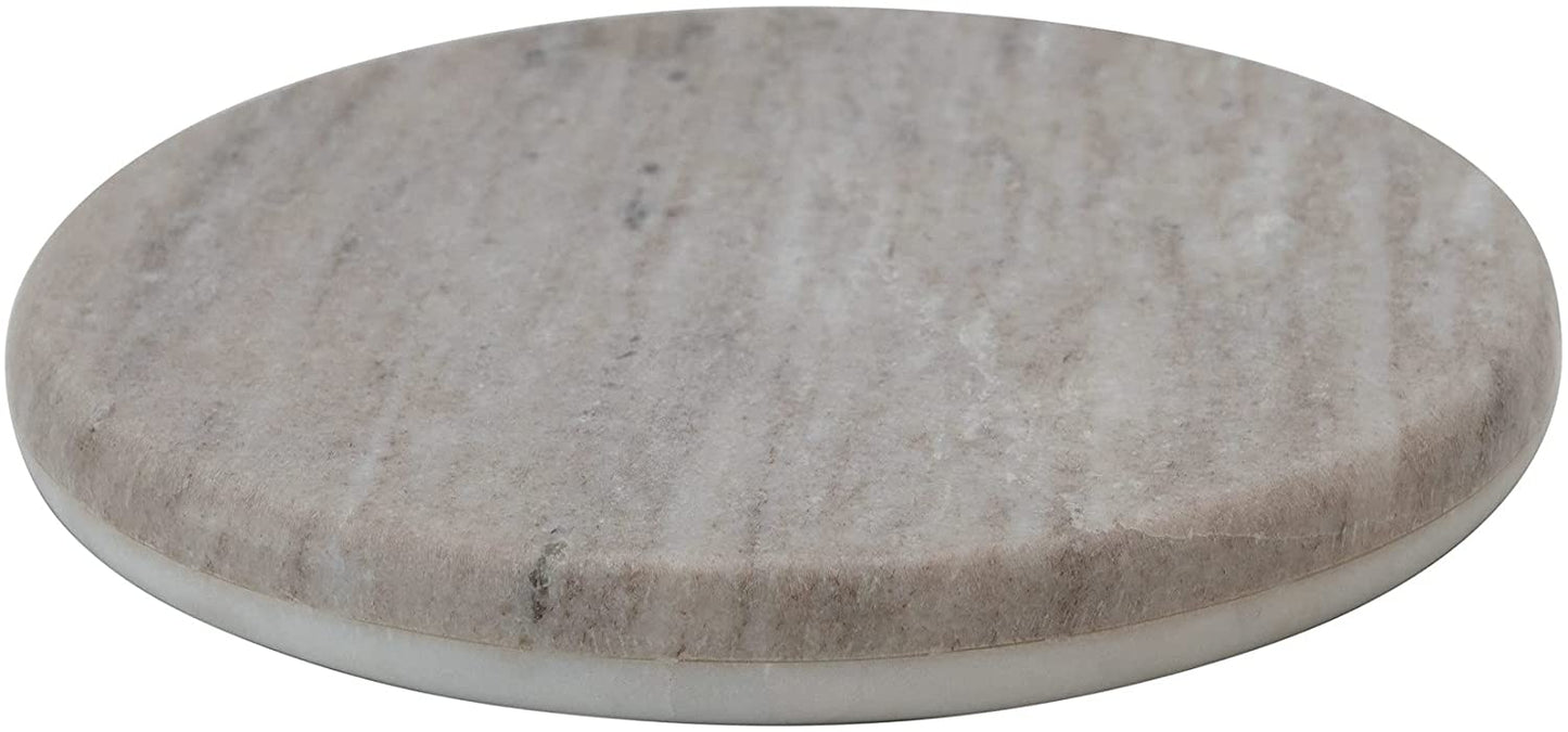 angled view of the reversible round marble board on a white background