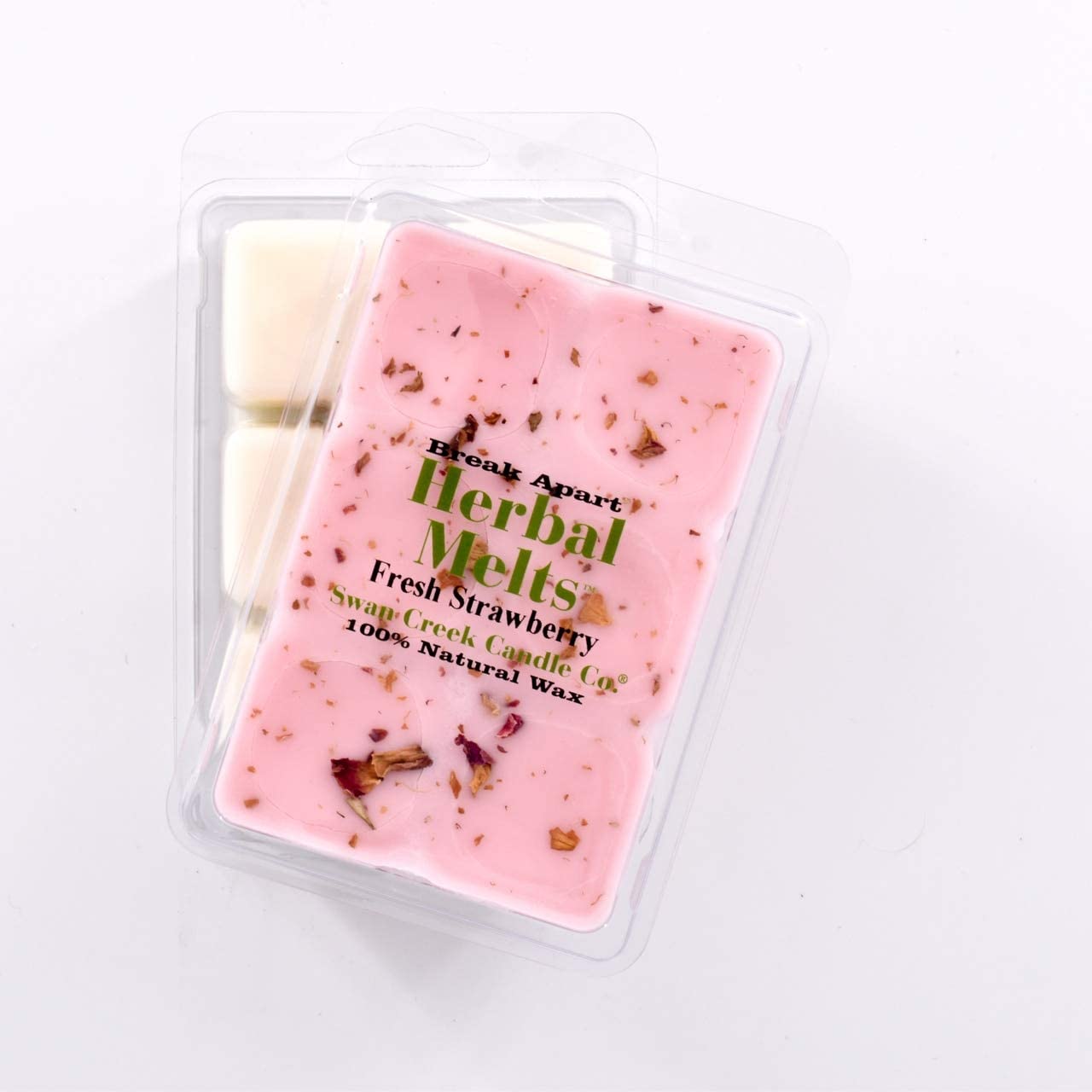 pink wax with bits of dried strawberries on top in packaging with another package showing the bottom of the wax melts break apart design.