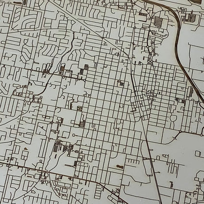 close up view of the burnt wood map of conway in ivory