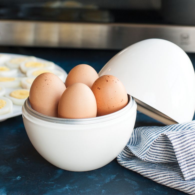 Microwave Egg Boiler with lid off and filled with 4 raw eggs.