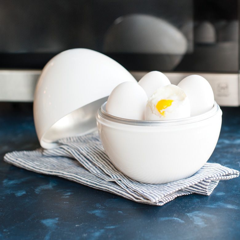 Microwave Egg Boiler with lid off and filled with 4 cooked and peeled eggs.