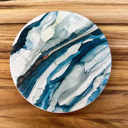 stone coaster with abstract design of ocean tides.