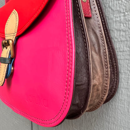 side view of purse showing three brown gussets.