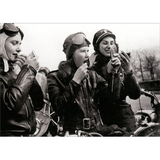 front of card is a black and white photograph of three women putting on makeup while sitting on motorcycles