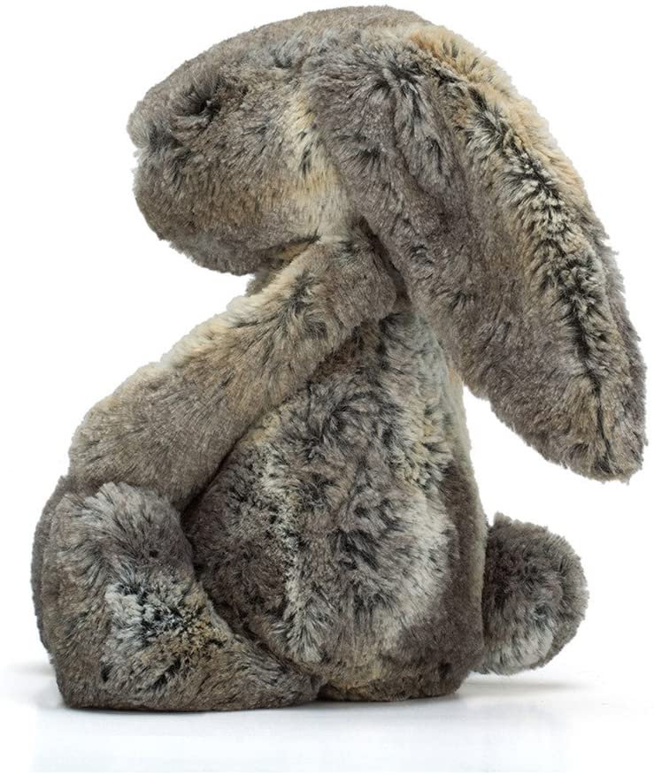 side view of woodland bashful bunny on a white background