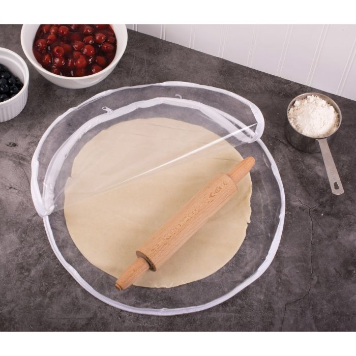 the 14 inch pie crust maker displayed with rolled pastry rolling pin and bowls of fruit on a gray countertop