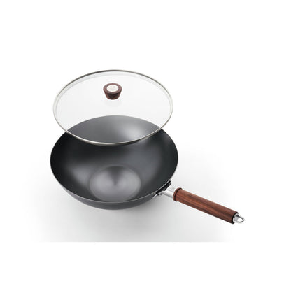 top view of wok with glass lid offset to show size on white background